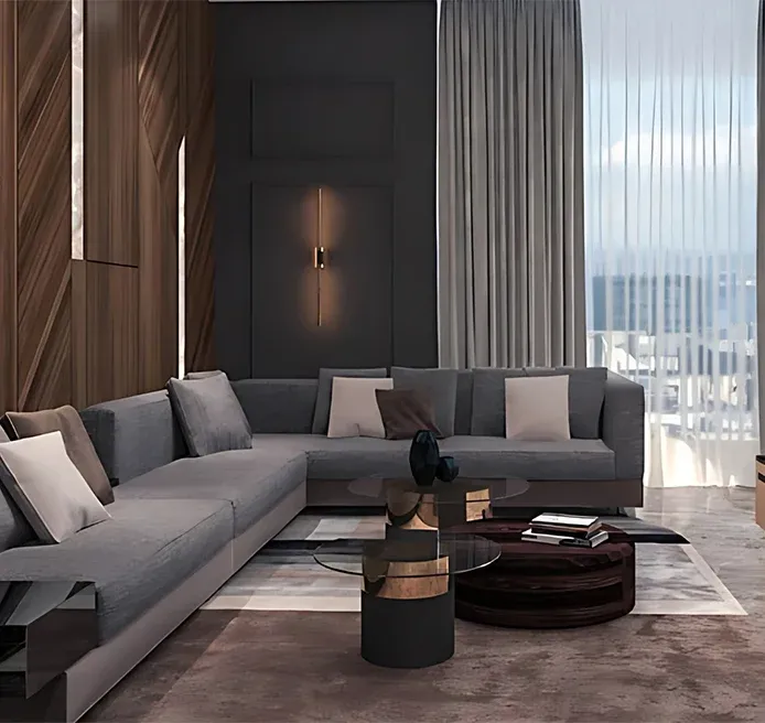 Modern luxury living room interior at DLF The Camellias Gurgaon featuring L shaped grey sectional sofa bespoke geometric wood wall paneling and bronze coffee table