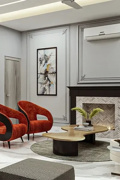 Luxury formal living area at M3M Golfestate featuring a fireplace surround rust red accent armchairs and custom organic coffee table on marble floor