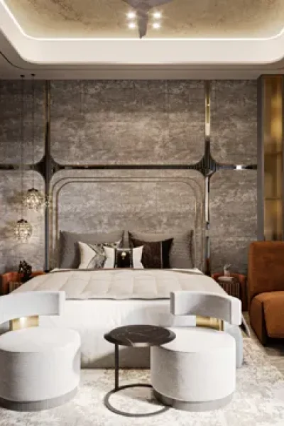 Luxury master bedroom interior at M3M Golfestate Gurgaon featuring textured stone accent wall metallic trim inlay backlit tray ceiling and velvet lounge seating