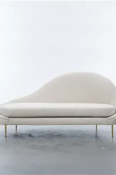 Custom curved cream velvet chaise lounge furniture piece with slim gold brass legs for luxury residence